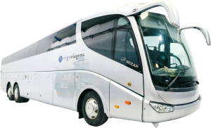 Front-right view of a white coach bus showing large windshield and curved cab, with Irizar logo and 'vego viagens' branding visible on the side, parked in a lot.